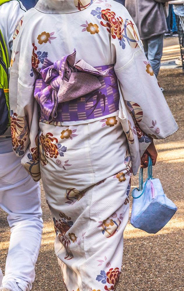 Colorful white traditional Japanese kimono, Kiyomizu Buddhist Temple, Kyoto, Japan.